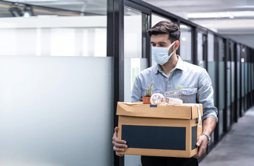 Employee carrying out their things in a box.